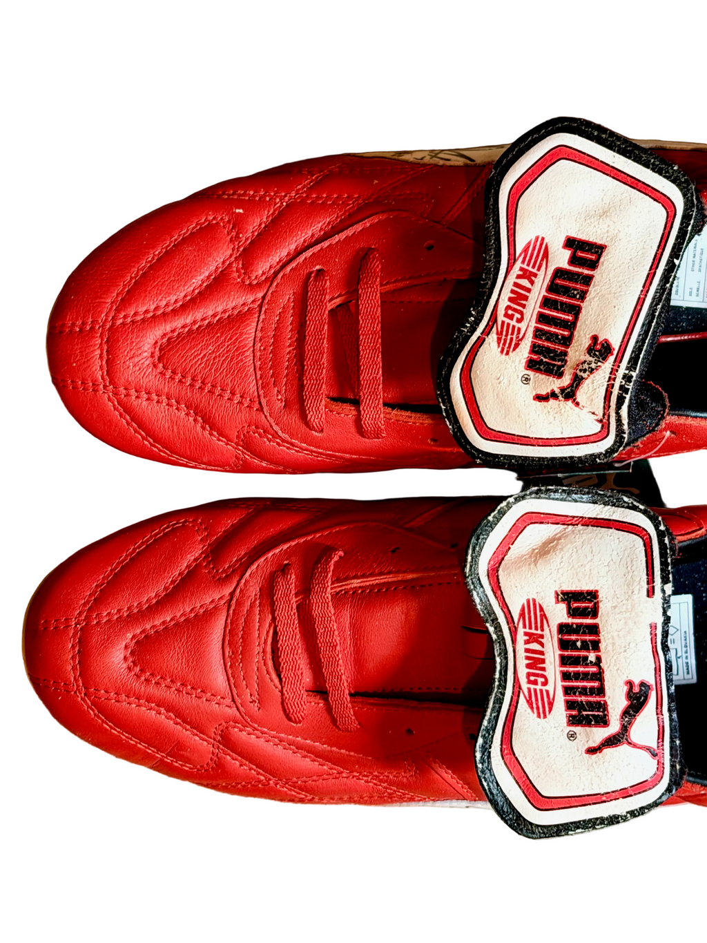 Vintage Puma King OG football boots in red/white, signed on both boots.