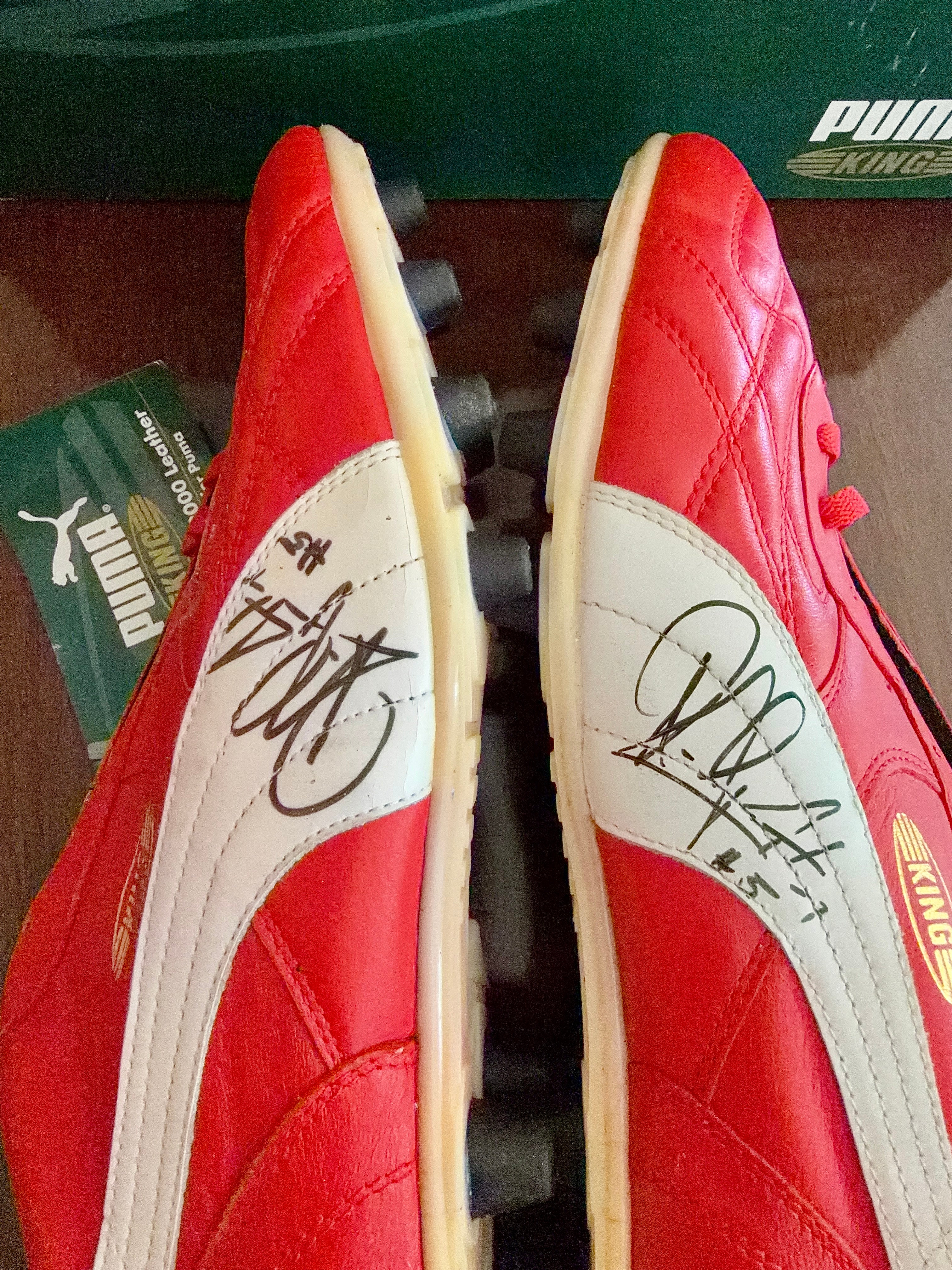Vintage Puma King OG football boots in red/white, signed on both boots.