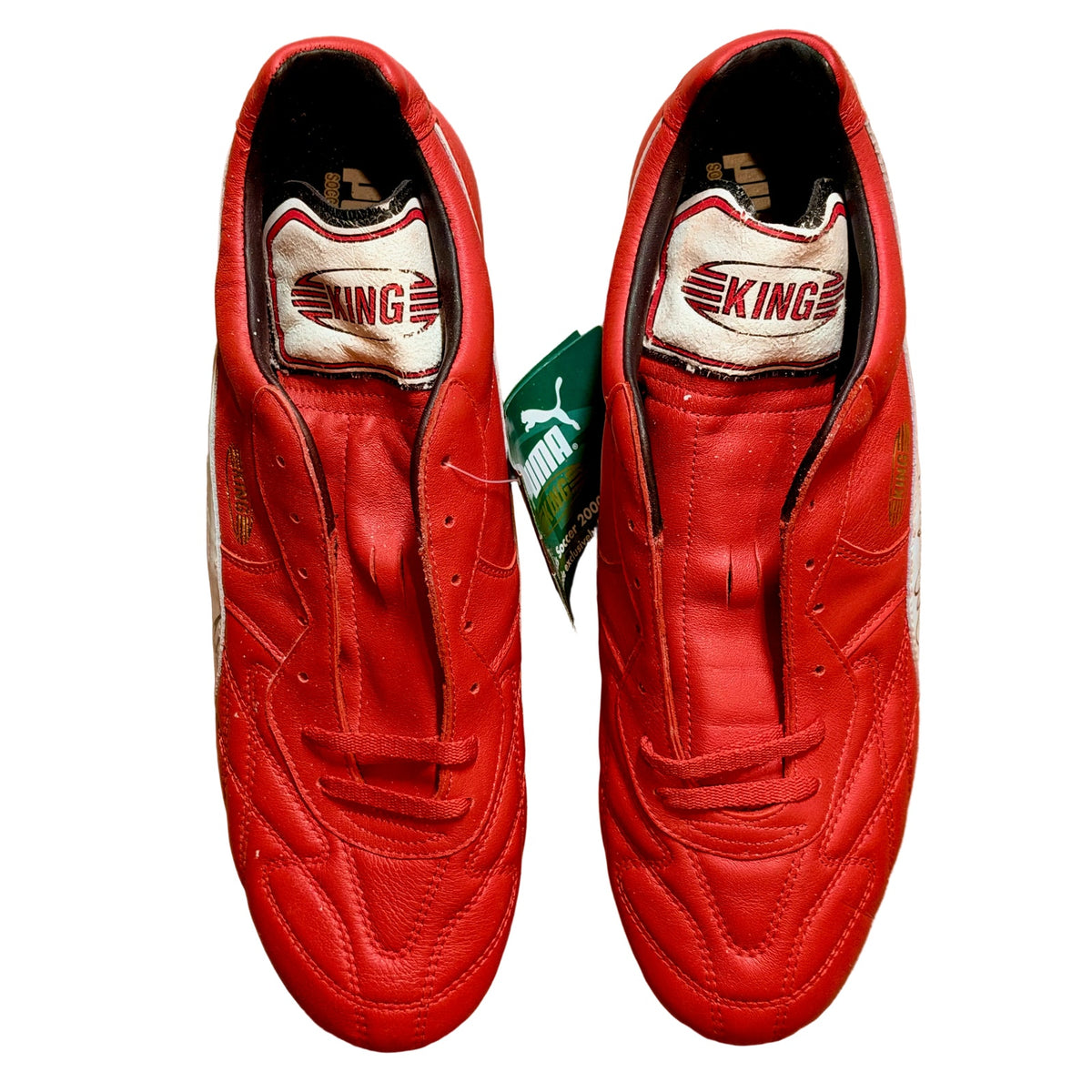 Vintage Puma King OG football boots in red/white, signed on both boots.