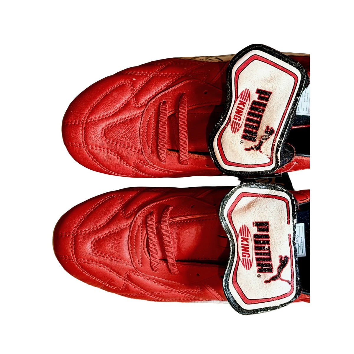 Vintage Puma King OG football boots in red/white, signed on both boots.